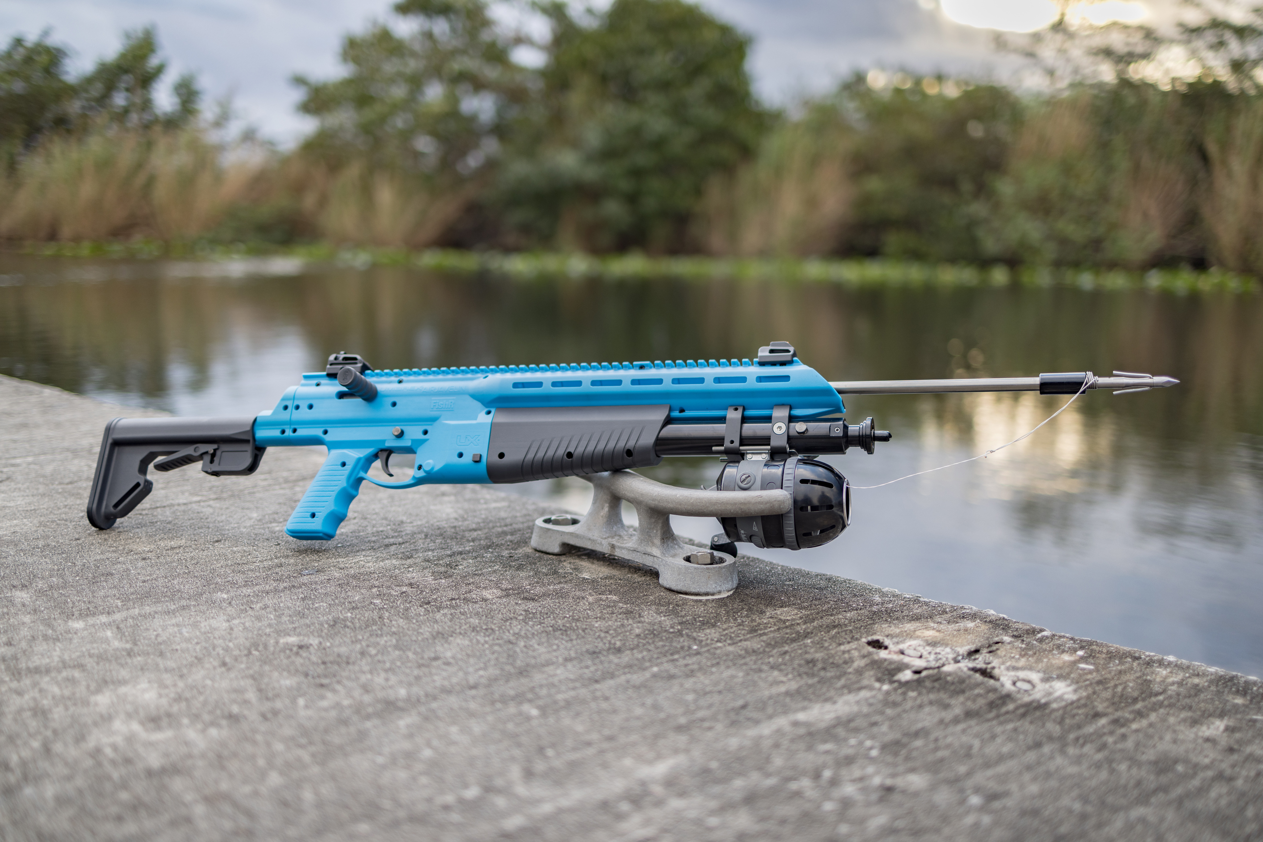 Umarex FISHR staged on a dock with arrow
